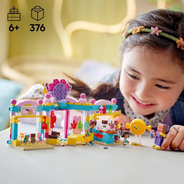 LEGO Friends Heartlake City Shop, set de joacă pentru fete cu vârsta peste 6 ani, joc de rol cu 2 mini-doll-uri, jucărie cu micro-doll și pisică 42649 Seturi de constructie Besuche den LEGO-Store